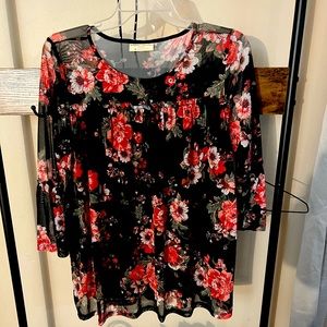 loose floral top I have sz SM M L & XL available all new with tags!